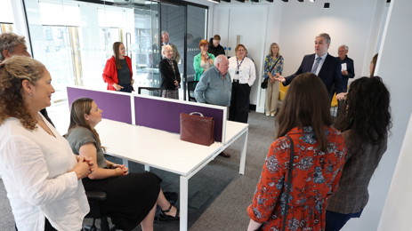 People in room talking together