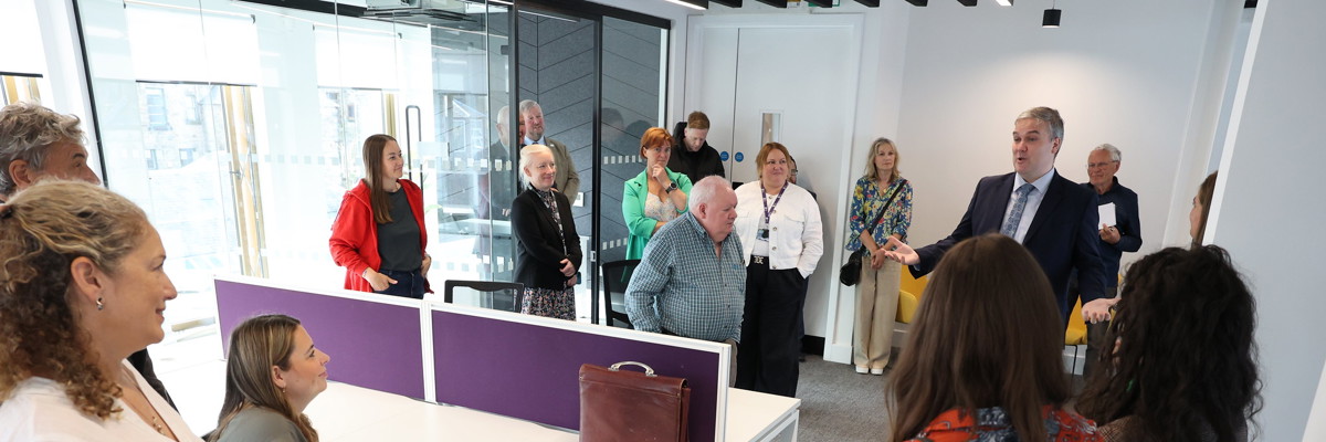People in room talking together