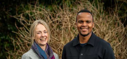 Pathways coach and client standing smiling at camera