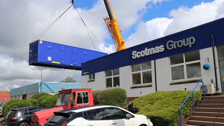 Shipping crate and crane outside Scotmas Group Building
