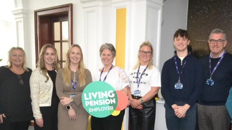 Staff with Living Pension sign