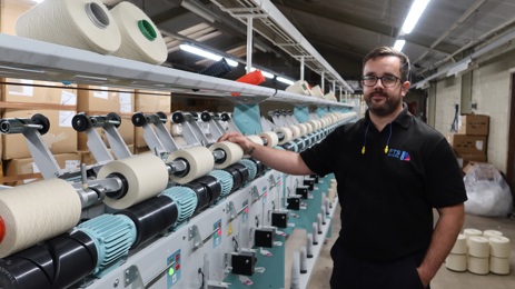 FTS Dyers employee with a winding machine