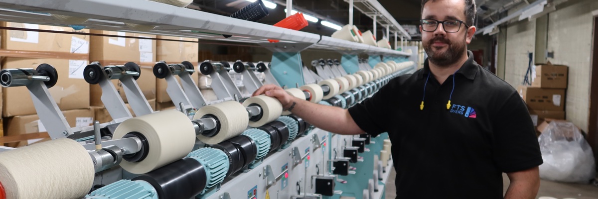 FTS Dyers employee with a winding machine
